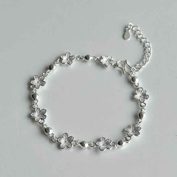 bracelet featuring hollow plum blossom designs