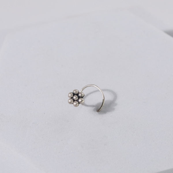 a sterling silver oxidized flower nosepin